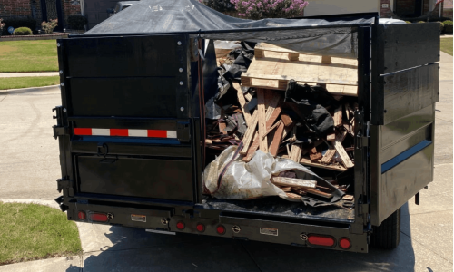 Person hauling trash in a truck